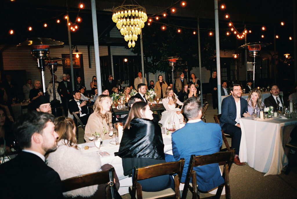 Joyful wedding reception with dancing at Springdale Station on film