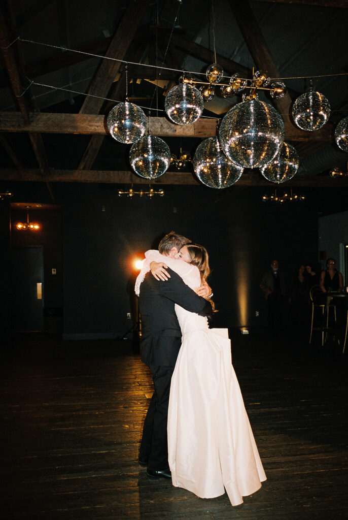 Guests dancing during a lively wedding reception in Austin, Texas on film