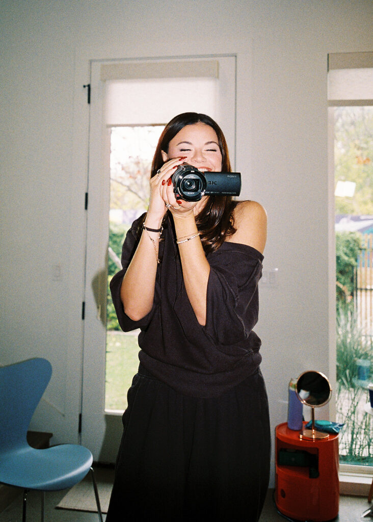 bride and groom getting ready for an Intimate wedding at Springdale Station in Austin, Texas photographed on film