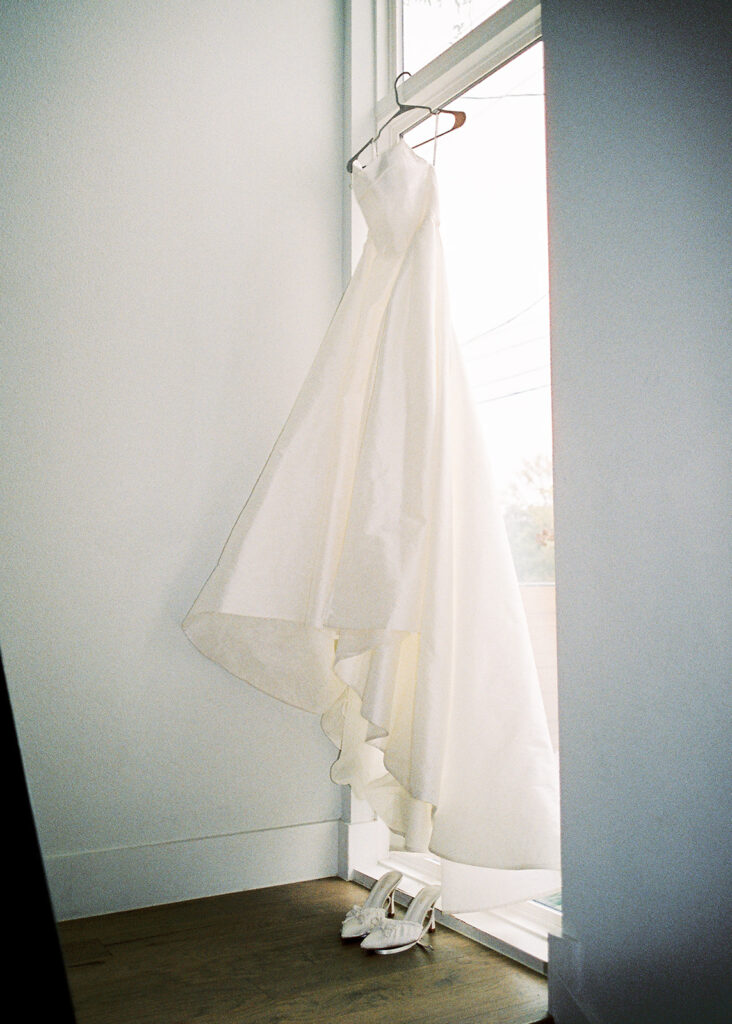 bride and groom getting ready for an Intimate wedding at Springdale Station in Austin, Texas photographed on film
