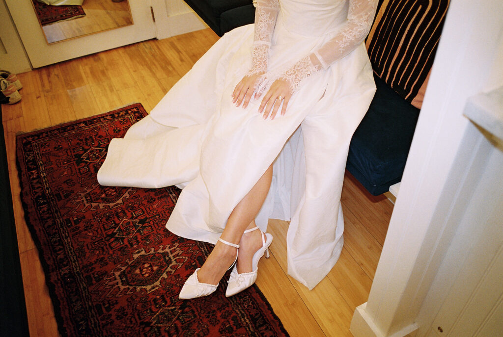 bride and groom getting ready for an Intimate wedding at Springdale Station in Austin, Texas photographed on film
