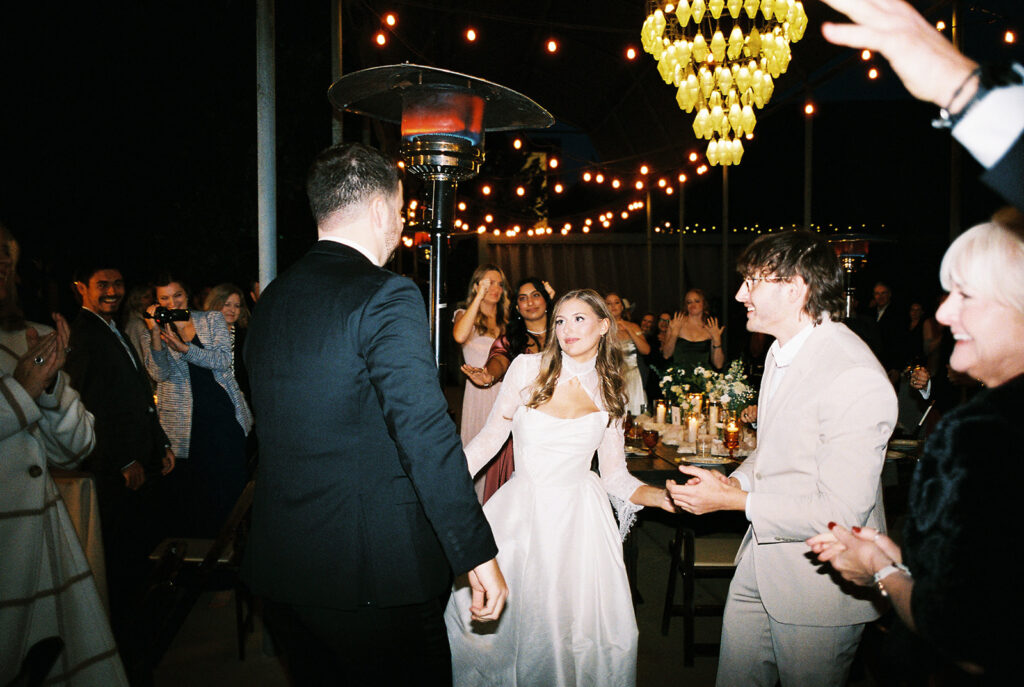 Joyful wedding reception with dancing at Springdale Station on film