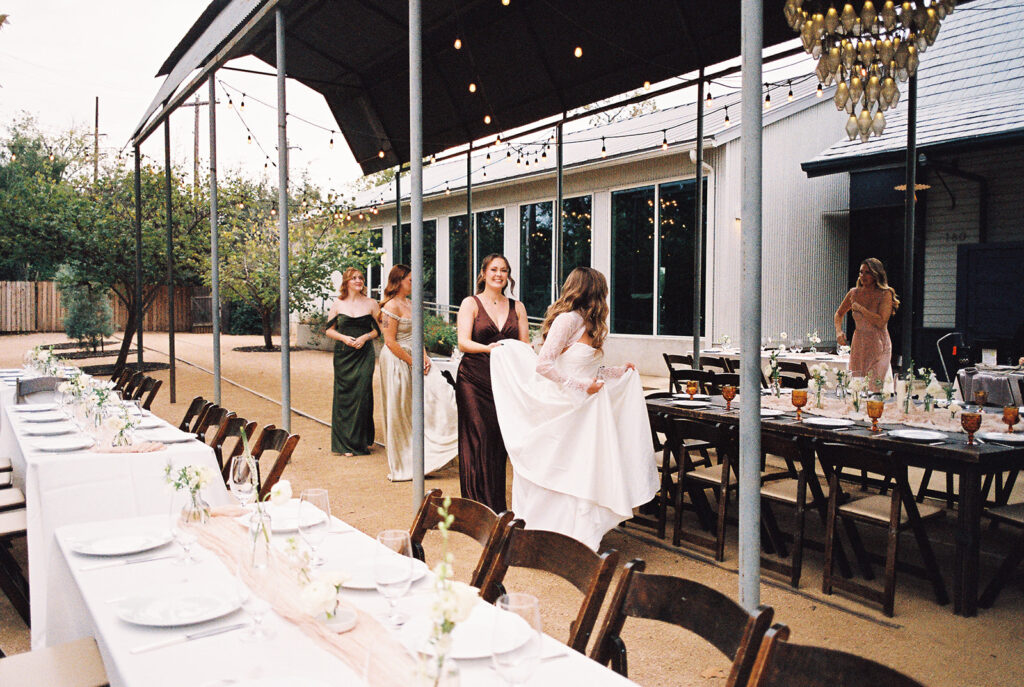 Bride and bridesmaids portrait outdoors at Springdale Station wedding venue