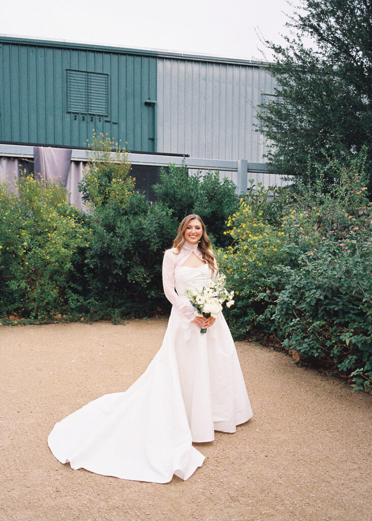 Bride and bridesmaids portrait outdoors at Springdale Station wedding venue