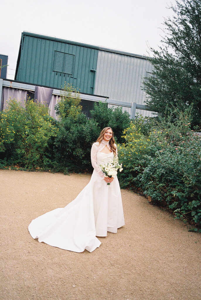 Bride and bridesmaids portrait outdoors at Springdale Station wedding venue