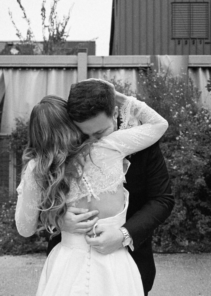 Emotional first look during an intimate wedding in Austin, Texas photographed on film