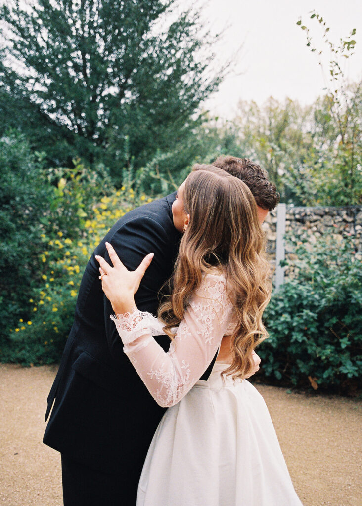 Emotional first look during an intimate wedding in Austin, Texas photographed on film