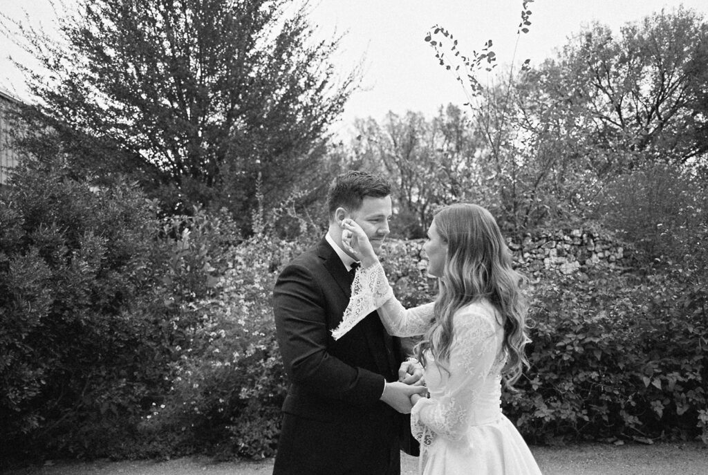 Emotional first look during an intimate wedding in Austin, Texas photographed on film