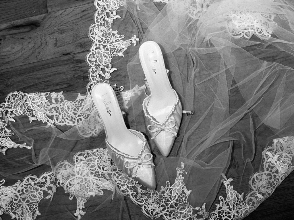 bride and groom getting ready for an Intimate wedding at Springdale Station in Austin, Texas photographed on film