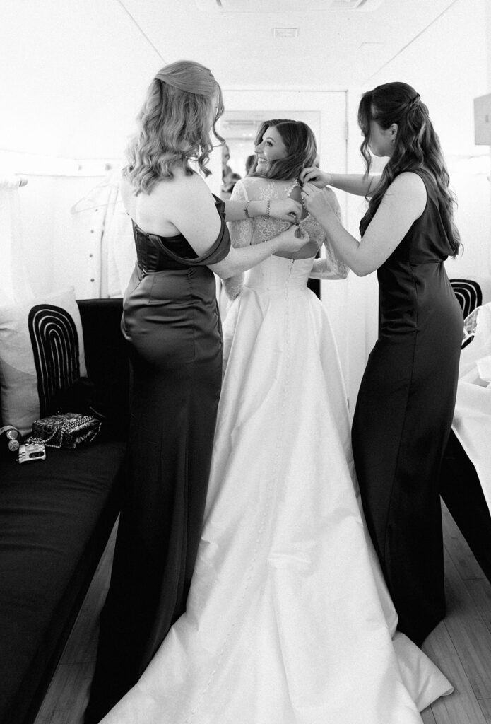 bride and groom getting ready for an Intimate wedding at Springdale Station in Austin, Texas photographed on film