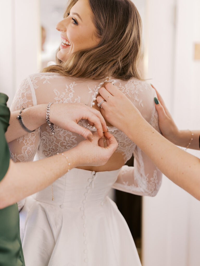 bride and groom getting ready for an Intimate wedding at Springdale Station in Austin, Texas photographed on film