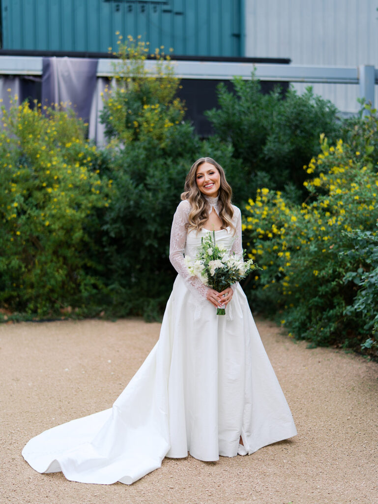 Bride and bridesmaids portrait outdoors at Springdale Station wedding venue