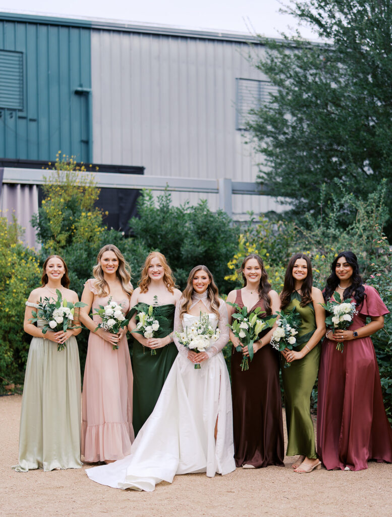 Bride and bridesmaids portrait outdoors at Springdale Station wedding venue