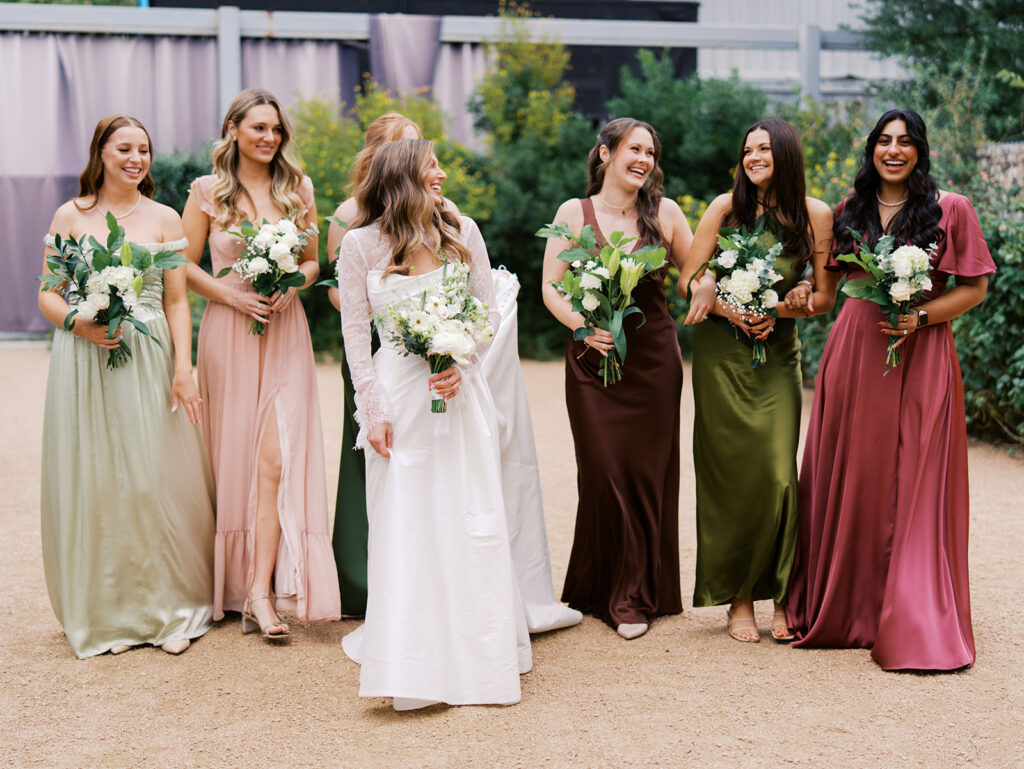Bride and bridesmaids portrait outdoors at Springdale Station wedding venue