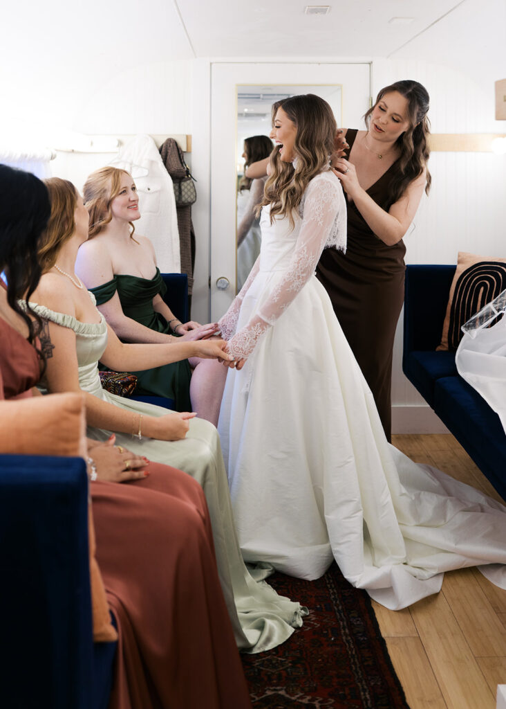 bride and groom getting ready for an Intimate wedding at Springdale Station in Austin, Texas photographed on film