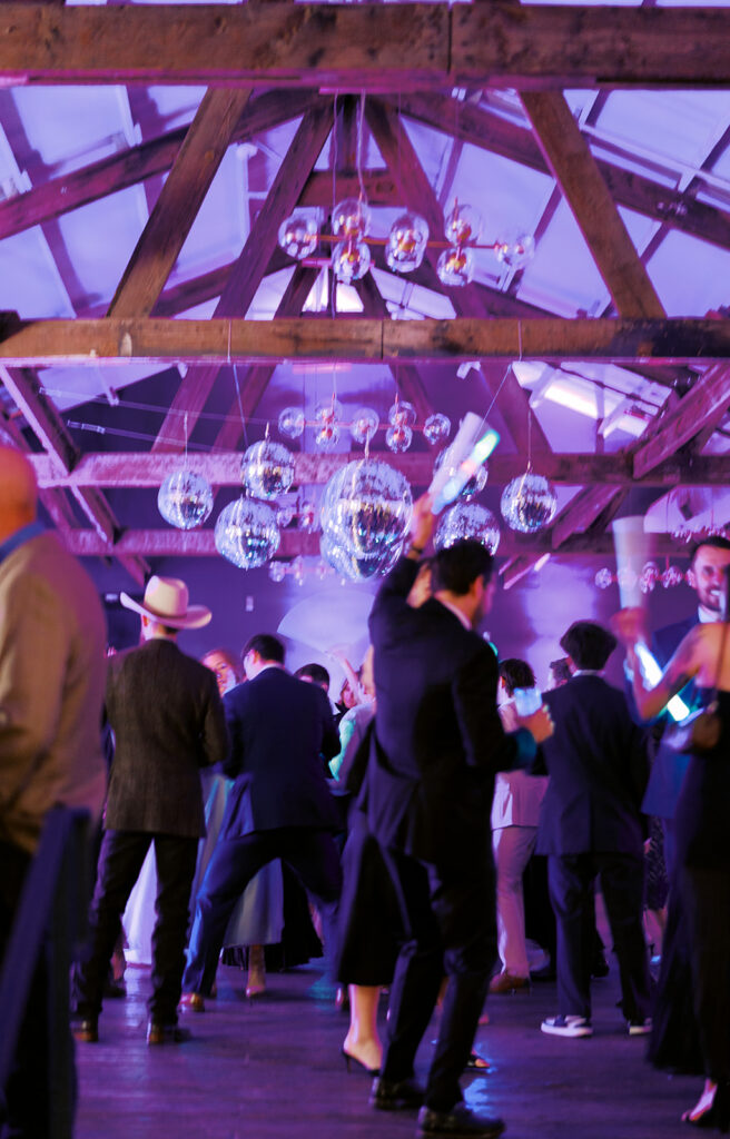 Guests dancing during a lively wedding reception in Austin, Texas on film