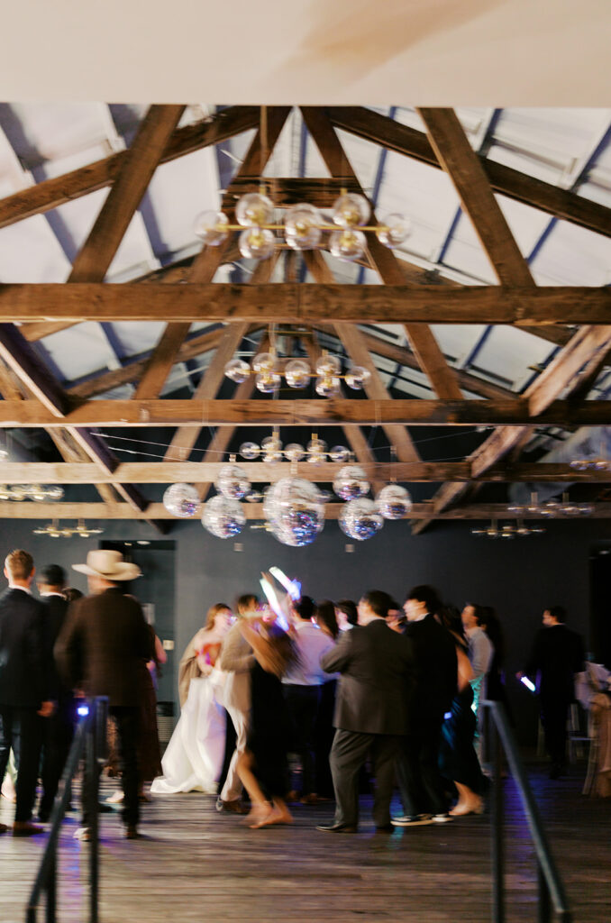 Guests dancing during a lively wedding reception in Austin, Texas on film