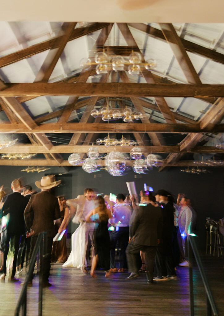 Guests dancing during a lively wedding reception in Austin, Texas on film