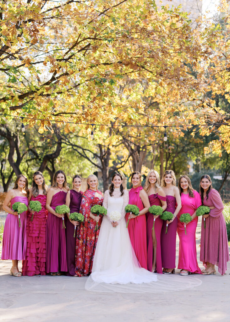 Joyful wedding party and newlyweds celebrating their Southwest School of Art wedding in San Antonio