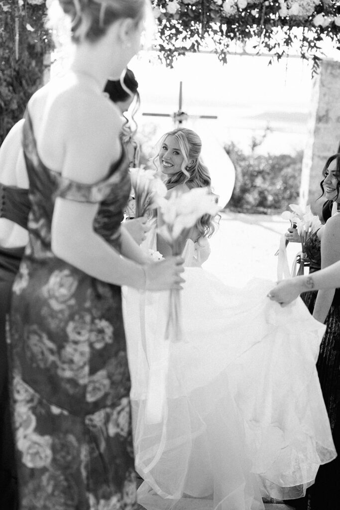 Bride and bridesmaids at vintage villas over looking lake travis on film