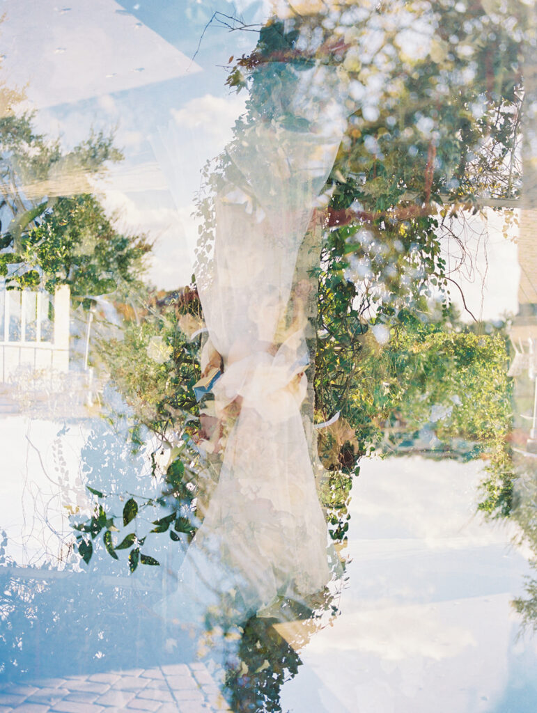 Romantic moment between bride and groom with scenic lake backdrop