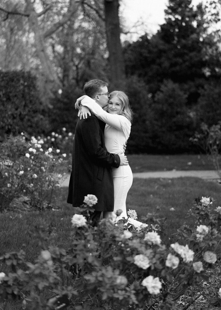 Sierra and Liam walking together during their Dallas Arboretum engagement photos