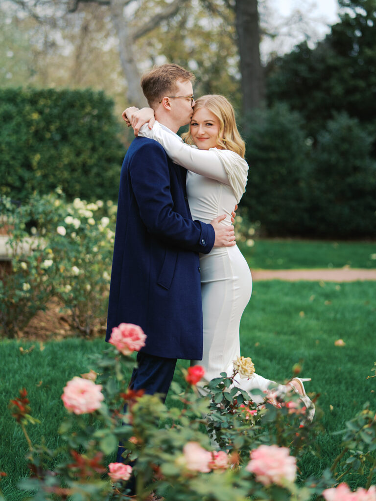 Sierra and Liam walking together during their Dallas Arboretum engagement photos