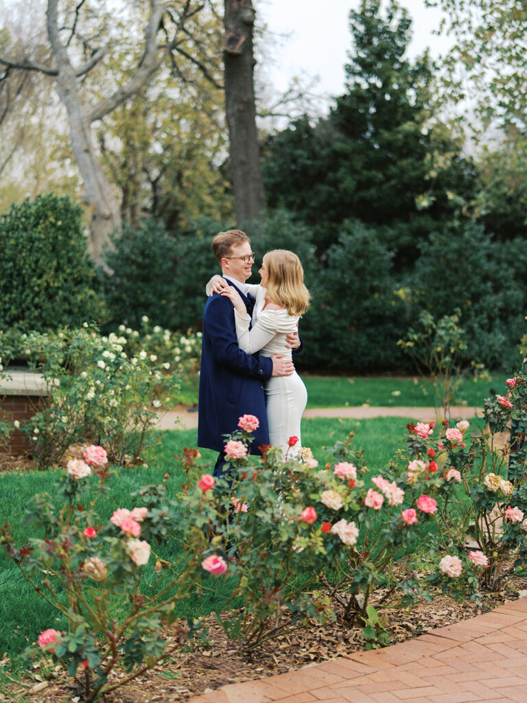 Sierra and Liam walking together during their Dallas Arboretum engagement photos