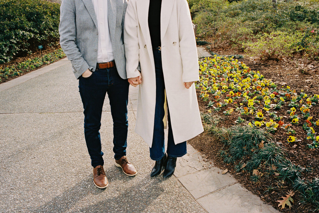 Candid moments captured on film during an arboretum engagement session