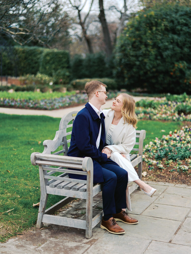 Sierra and Liam walking together during their Dallas Arboretum engagement photos