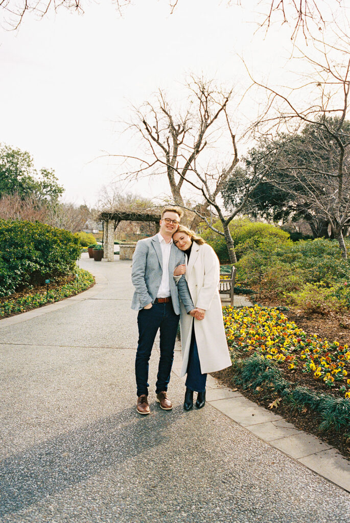 Candid moments captured on film during an arboretum engagement session
