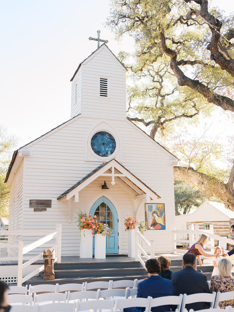 Colorful outdoor wedding ceremony at Rancho Pillow Round Top Texas