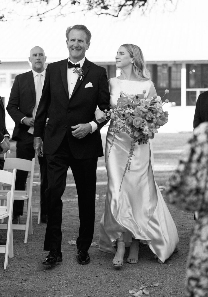 Colorful outdoor wedding ceremony at Rancho Pillow Round Top Texas