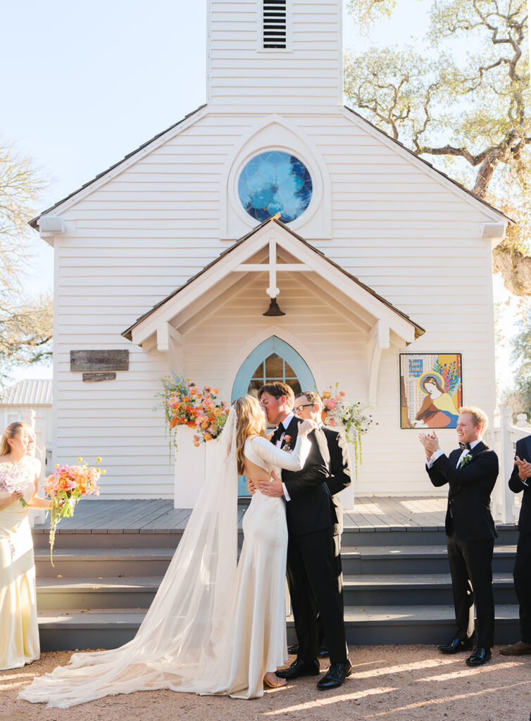 Colorful outdoor wedding ceremony at Rancho Pillow Round Top Texas