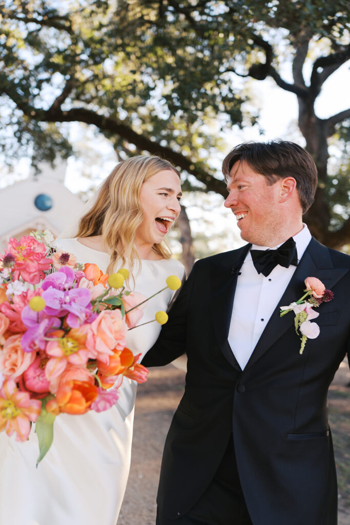 Colorful outdoor wedding ceremony at Rancho Pillow Round Top Texas