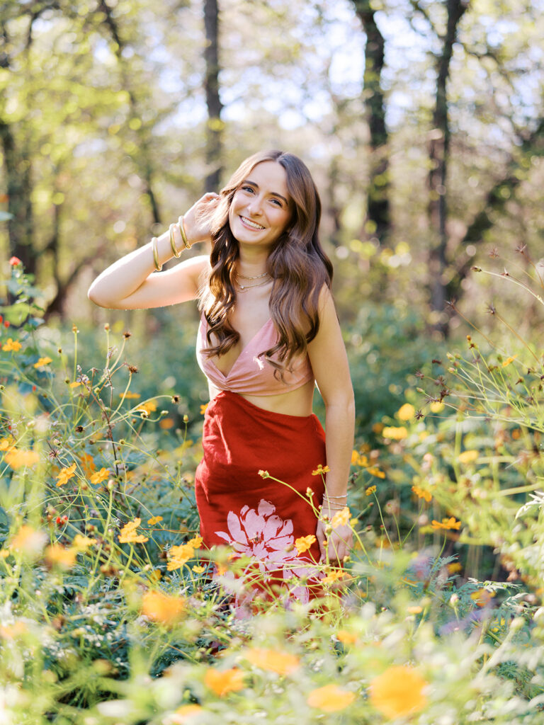 Austin senior portraits on film at Zilker Botanical Garden with Lily surrounded by lush greenery