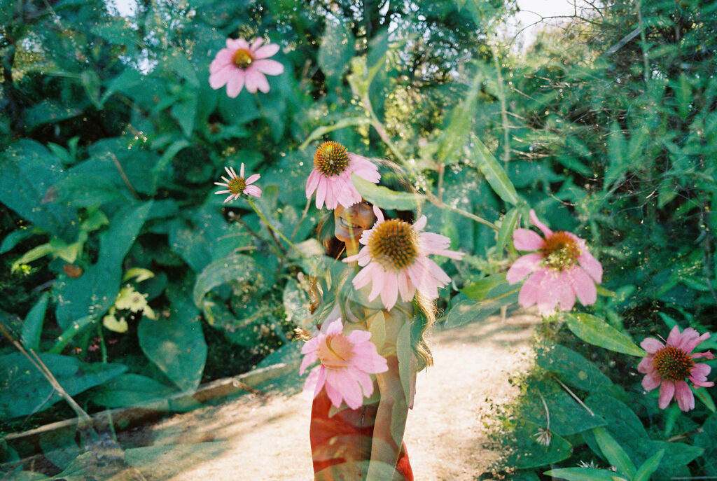 Lily smiling during Senior Portraits at Zilker Botanical Garden + South Congress in Austin Texas captured on film