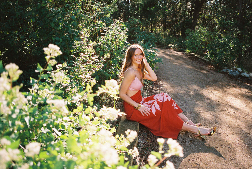 Lily smiling during Senior Portraits at Zilker Botanical Garden + South Congress in Austin Texas captured on film