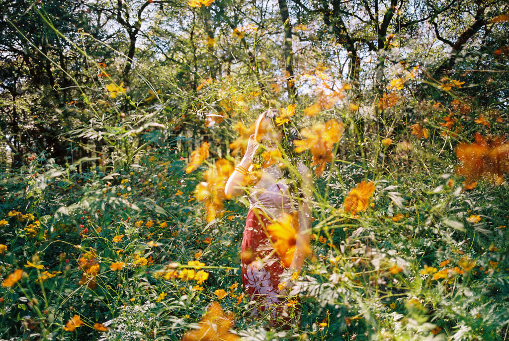 Lily smiling during Senior Portraits at Zilker Botanical Garden + South Congress in Austin Texas captured on film