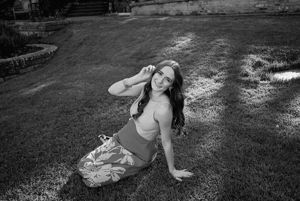 Lily smiling during Senior Portraits at Zilker Botanical Garden + South Congress in Austin Texas captured on film