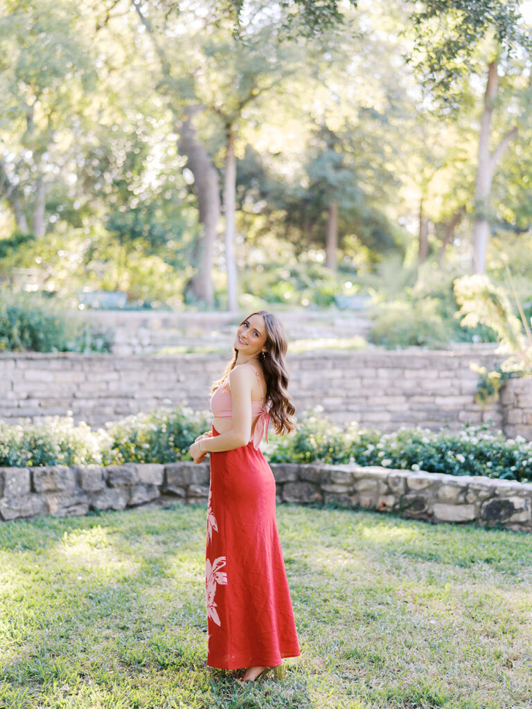 Austin senior portraits on film at Zilker Botanical Garden with Lily surrounded by lush greenery