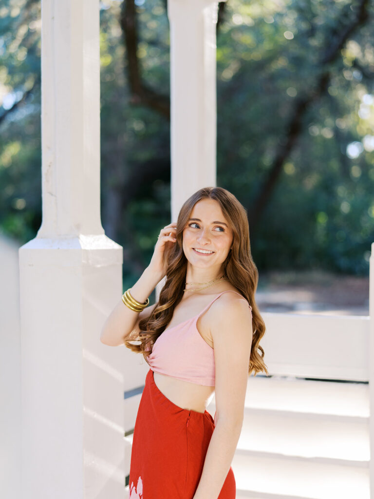 Austin senior portraits on film at Zilker Botanical Garden with Lily surrounded by lush greenery
