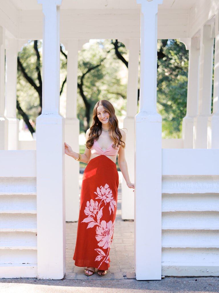 Austin senior portraits on film at Zilker Botanical Garden with Lily surrounded by lush greenery