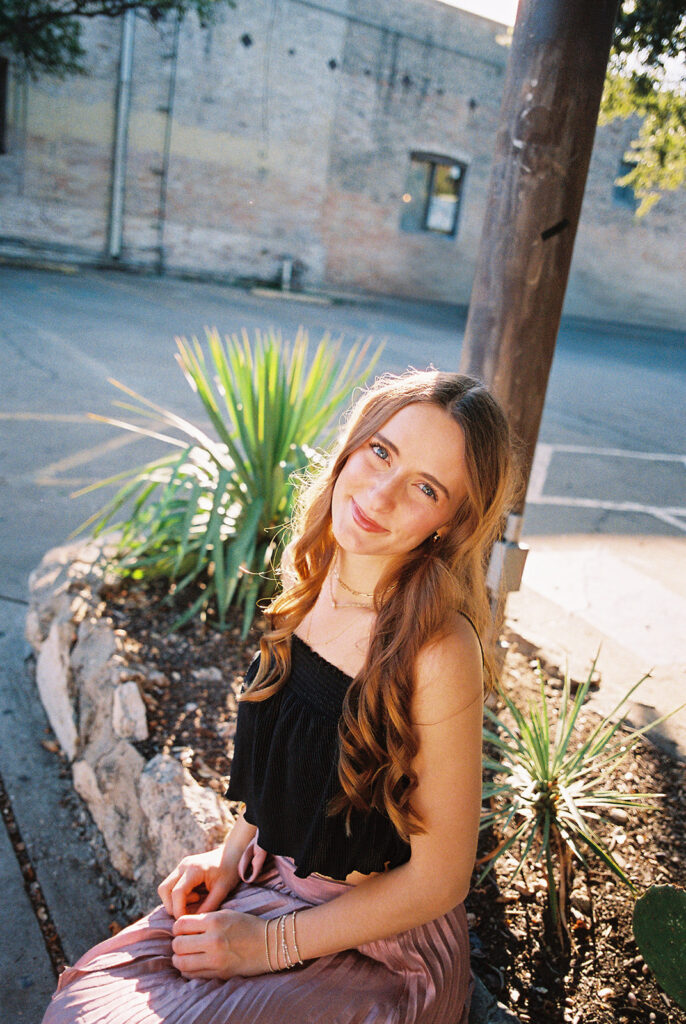 Stylish senior portraits of Lily on South Congress Avenue in Austin