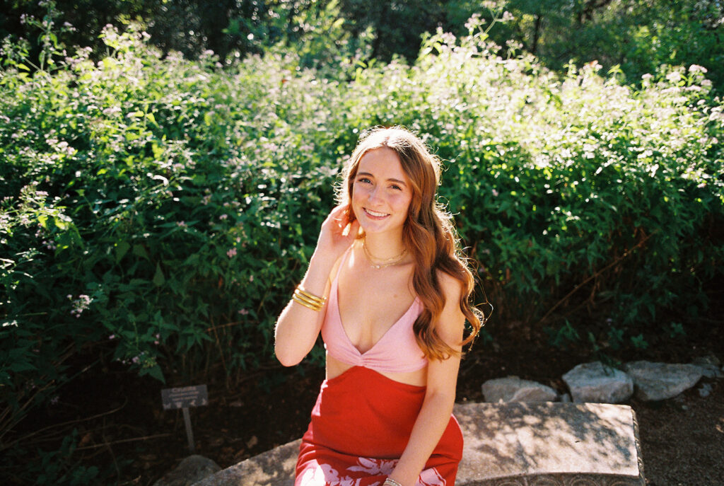 Lily smiling during Senior Portraits at Zilker Botanical Garden + South Congress in Austin Texas captured on film