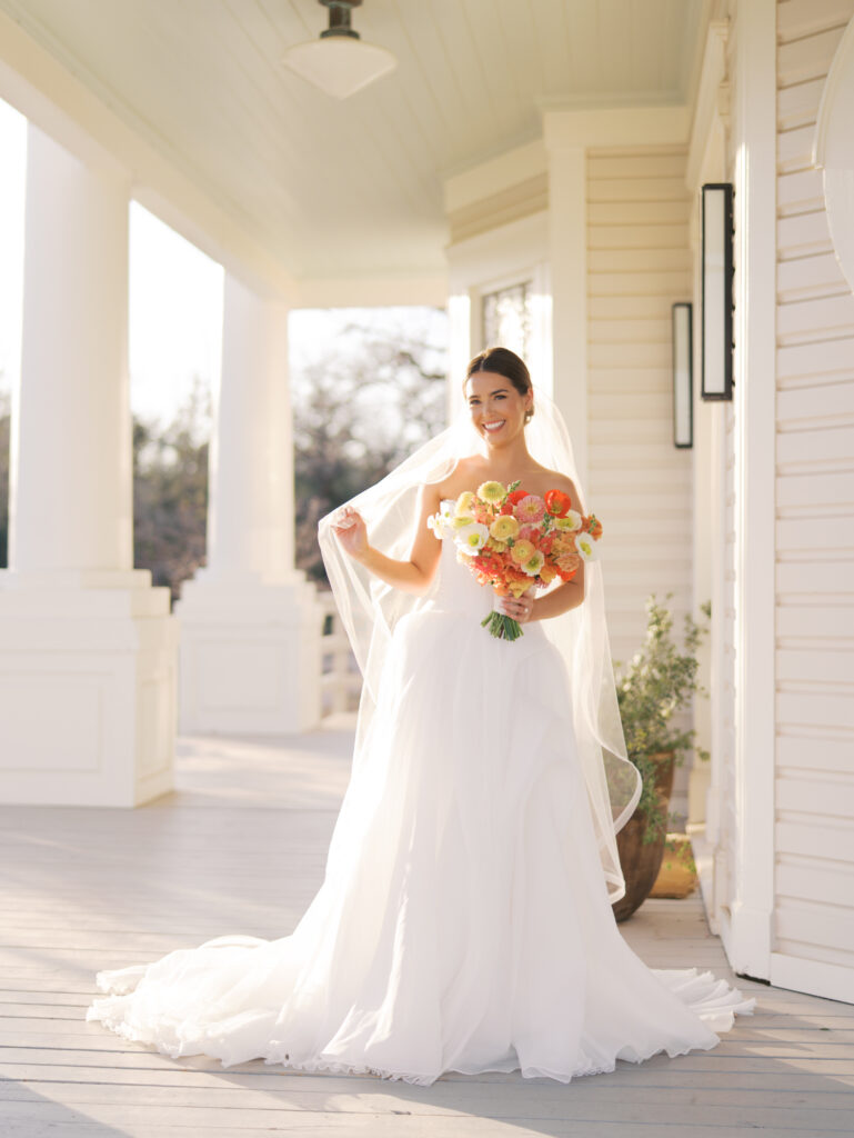 Film bridal portrait of bride walking through flowers at The Grand Lady Austin spring session