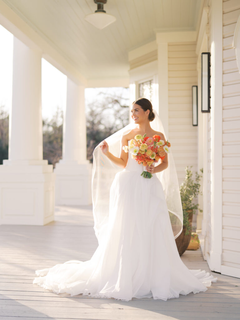 Film bridal portrait of bride walking through flowers at The Grand Lady Austin spring session