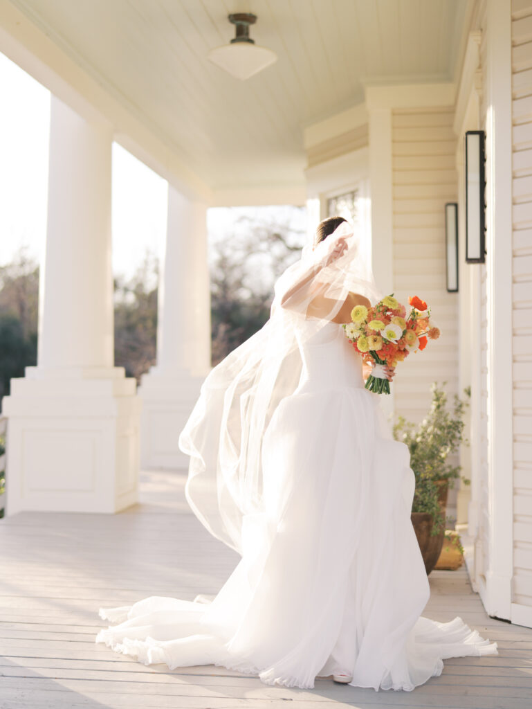 Film bridal portrait of bride walking through flowers at The Grand Lady Austin spring session