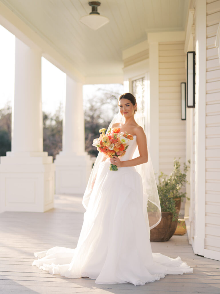 Film bridal portrait of bride walking through flowers at The Grand Lady Austin spring session