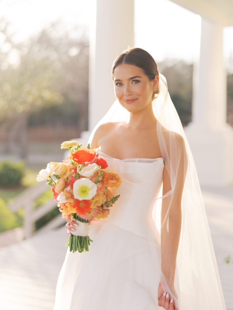 Film bridal portrait of bride walking through flowers at The Grand Lady Austin spring session